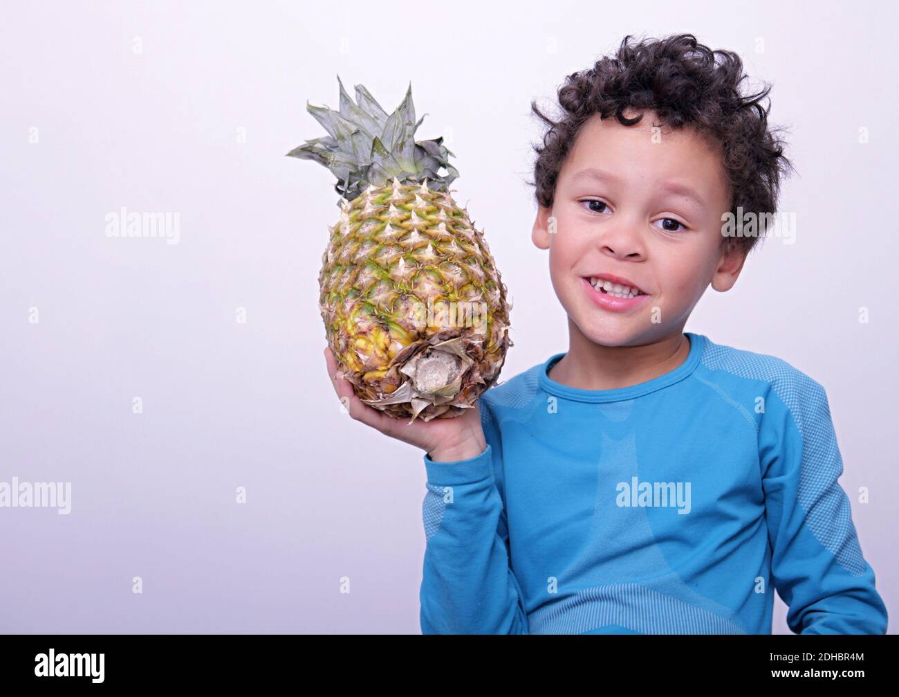 boy with pineapple on white background stock image stock photo Stock Photo