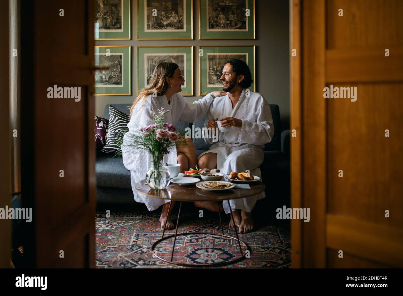 Happy couple in bathrobes in hotel room Stock Photo Alamy