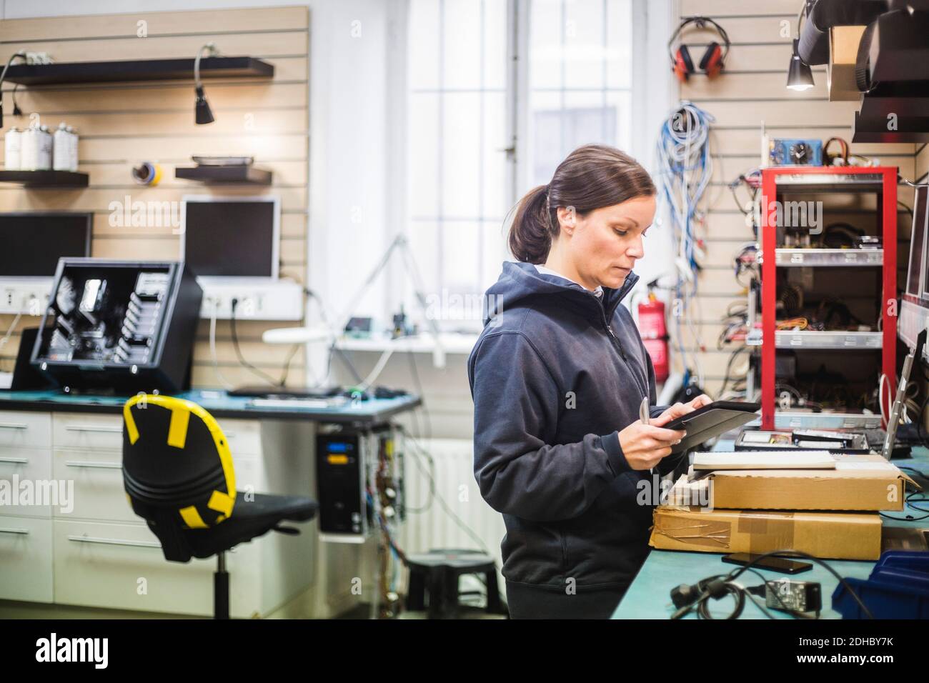 Engineer holding digital tablet in computer store Stock Photo