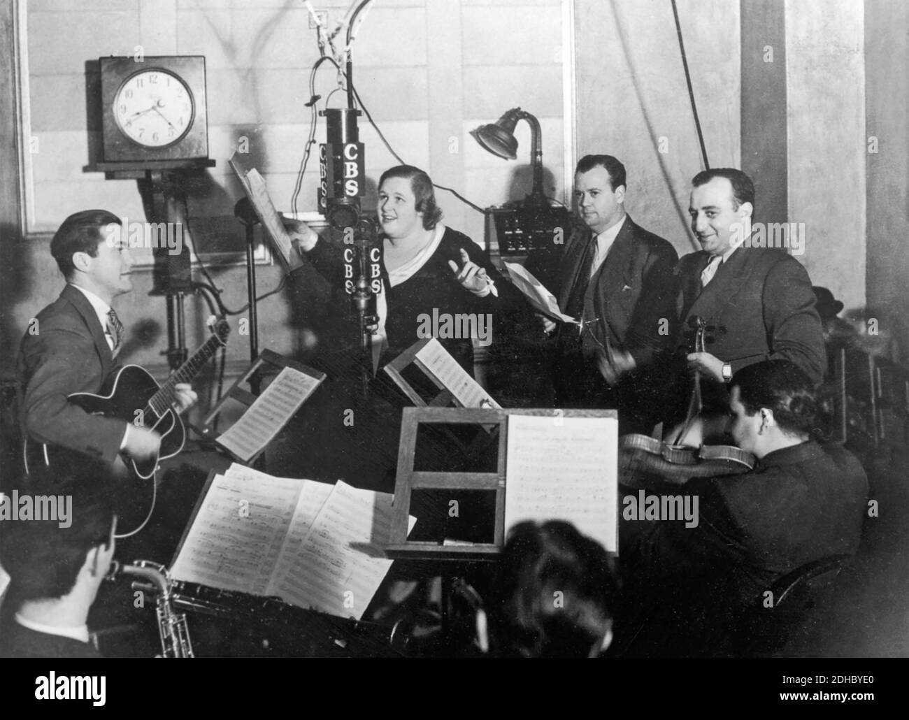 KATE SMITH (1907-1986) American soprano singer known for her version of Irving Berlin's 'God Bless America' in a recording studio about 1934. Stock Photo