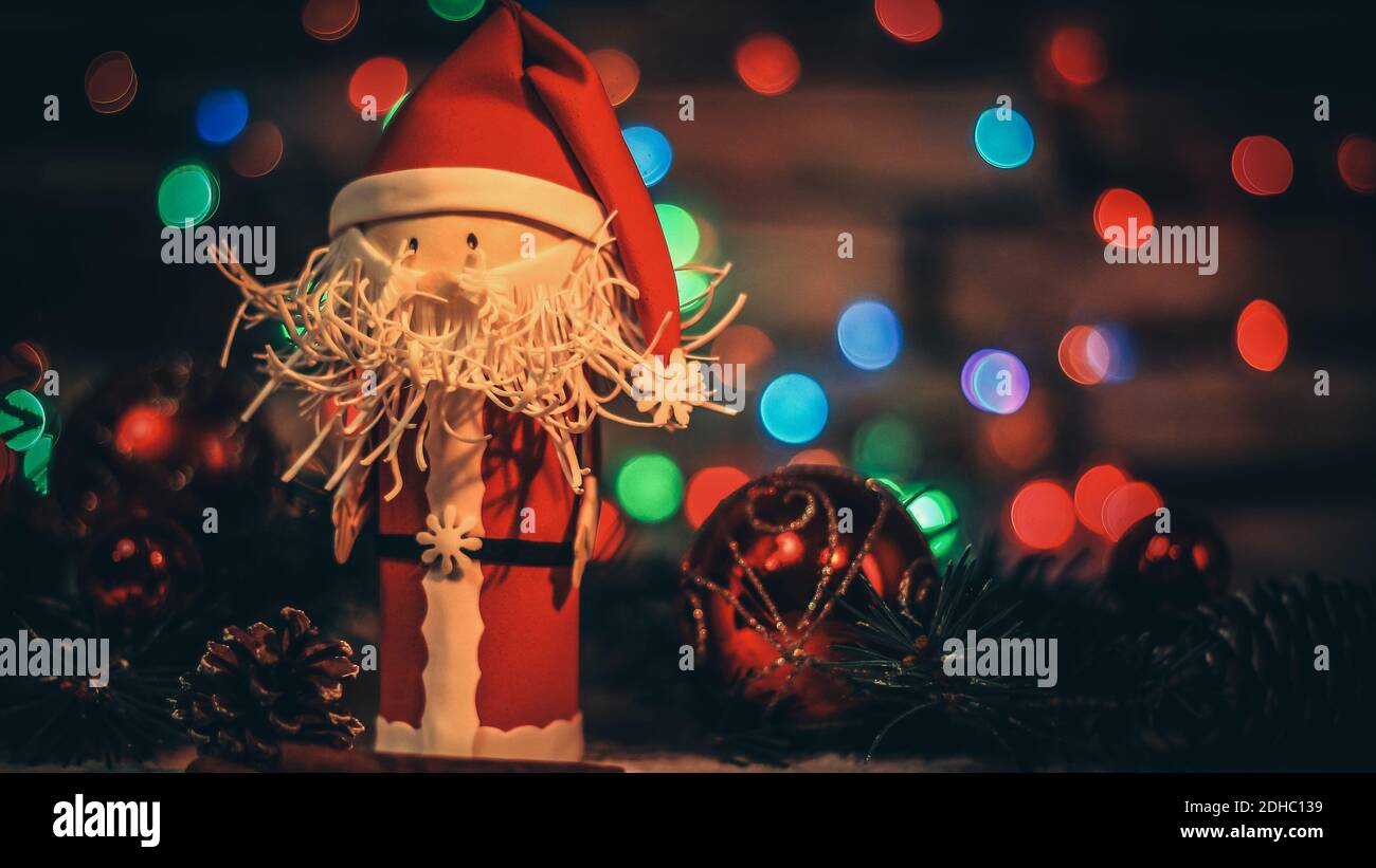 toy Santa Claus on a Christmas background Stock Photo - Alamy