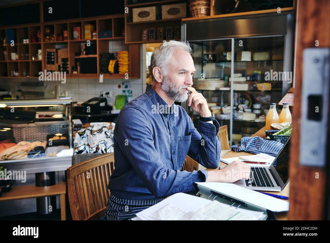 insurance salesman sitting at kitchen table