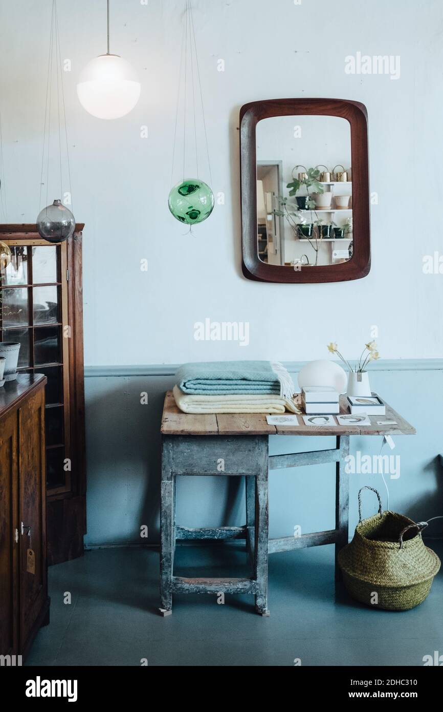 Table against wall Stock Photo Alamy