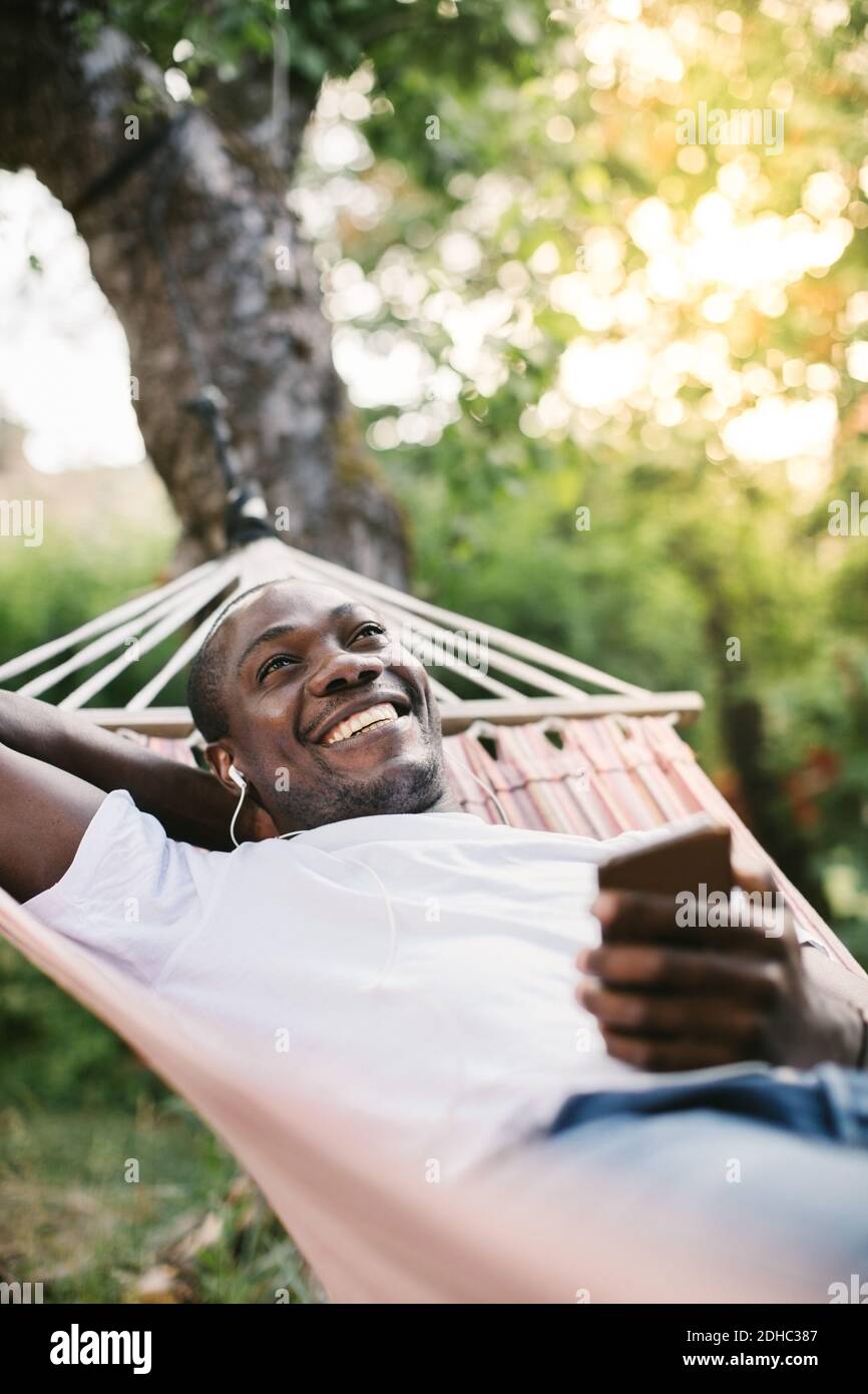 Smiling african man laying in hi-res stock photography and images - Alamy
