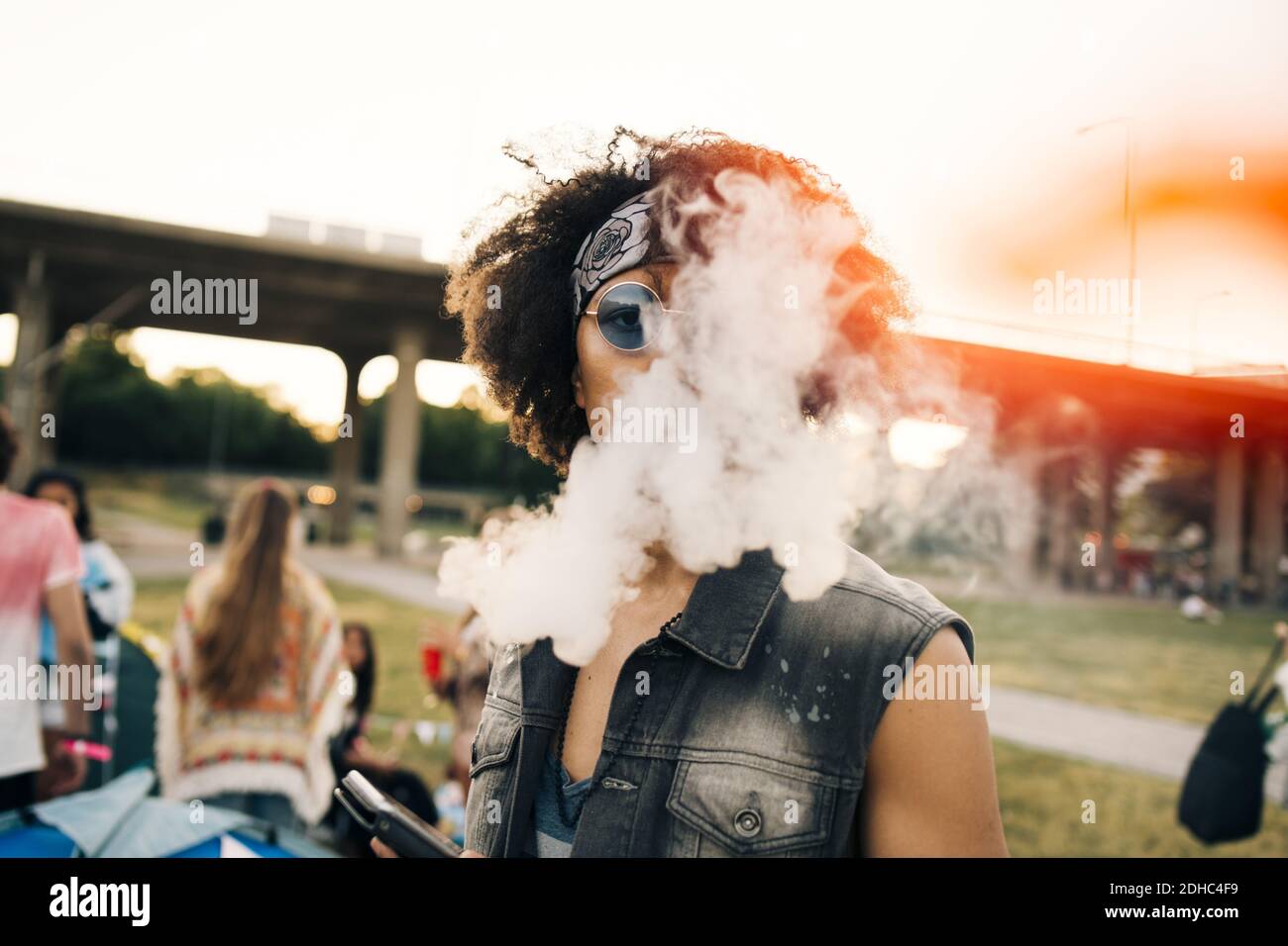 Close-up portrait of man smoking at music festival Stock Photo