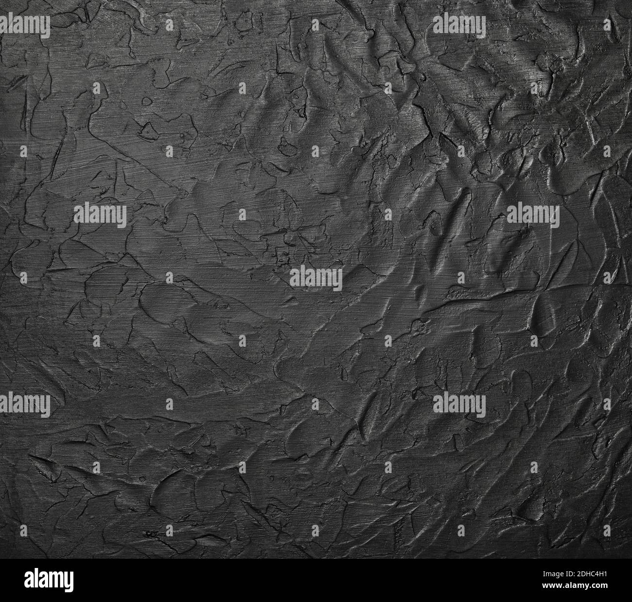 Black abstract background texture of uneven grunge surface with ...
