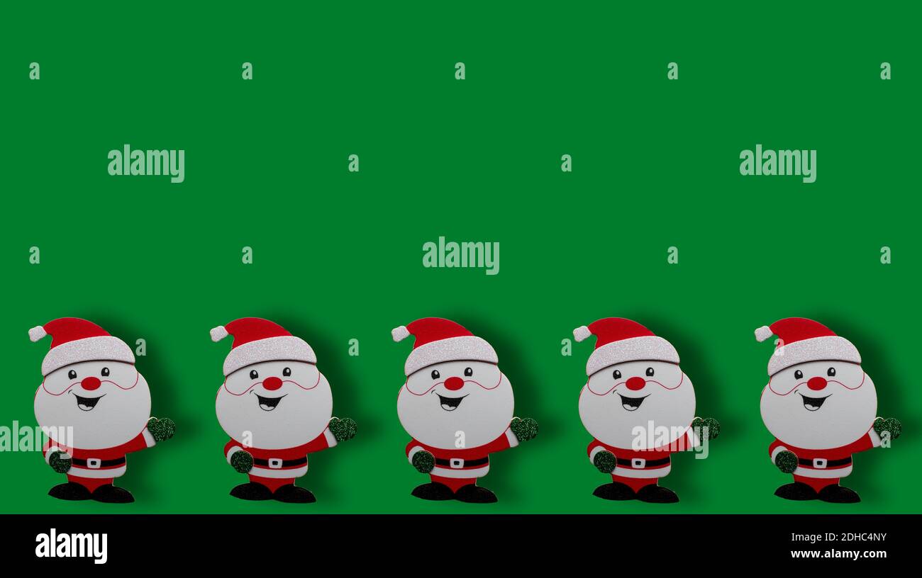 A green background with Santas for wallpaper Stock Photo - Alamy