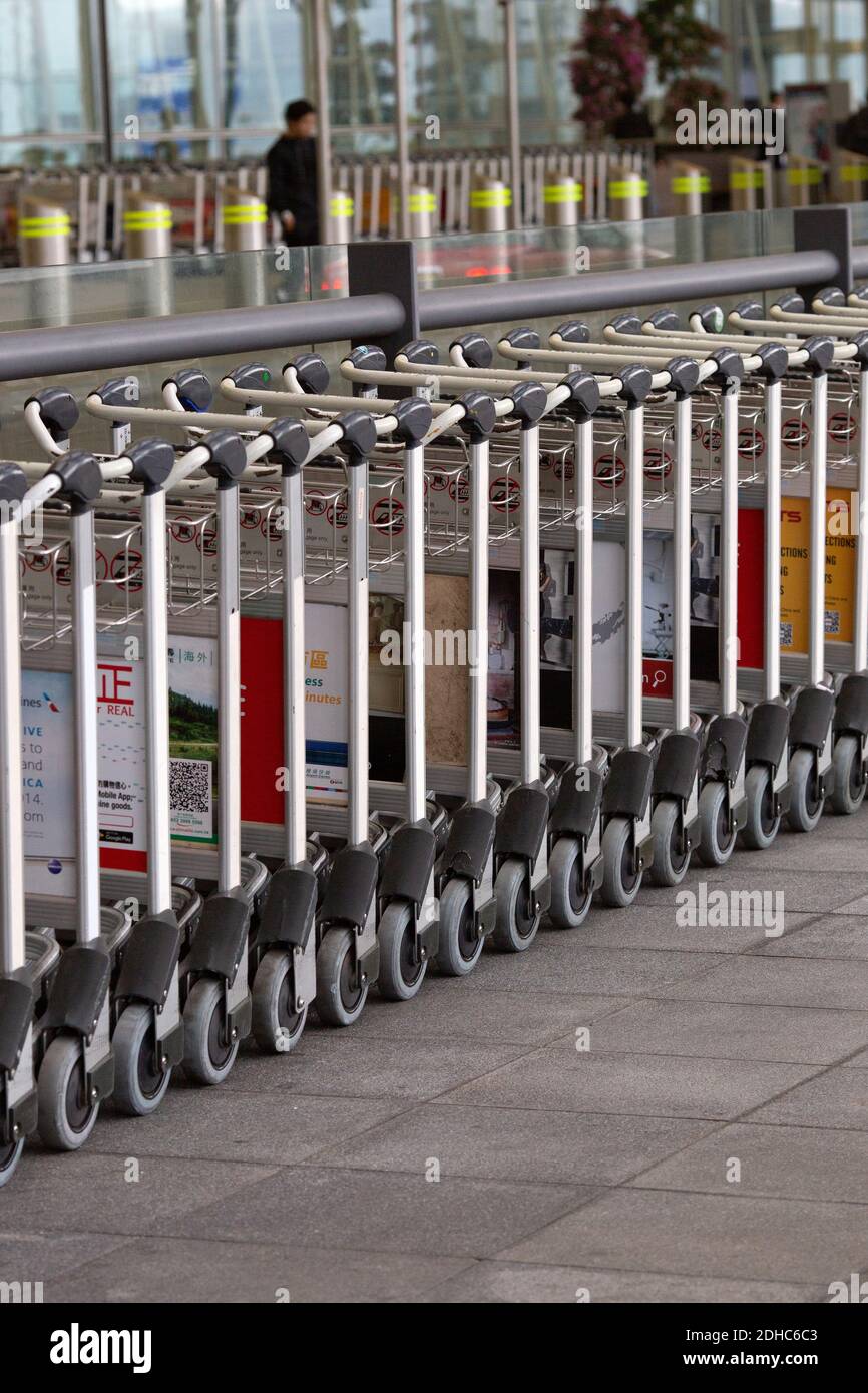 Rows of luggage trolleys Stock Photo