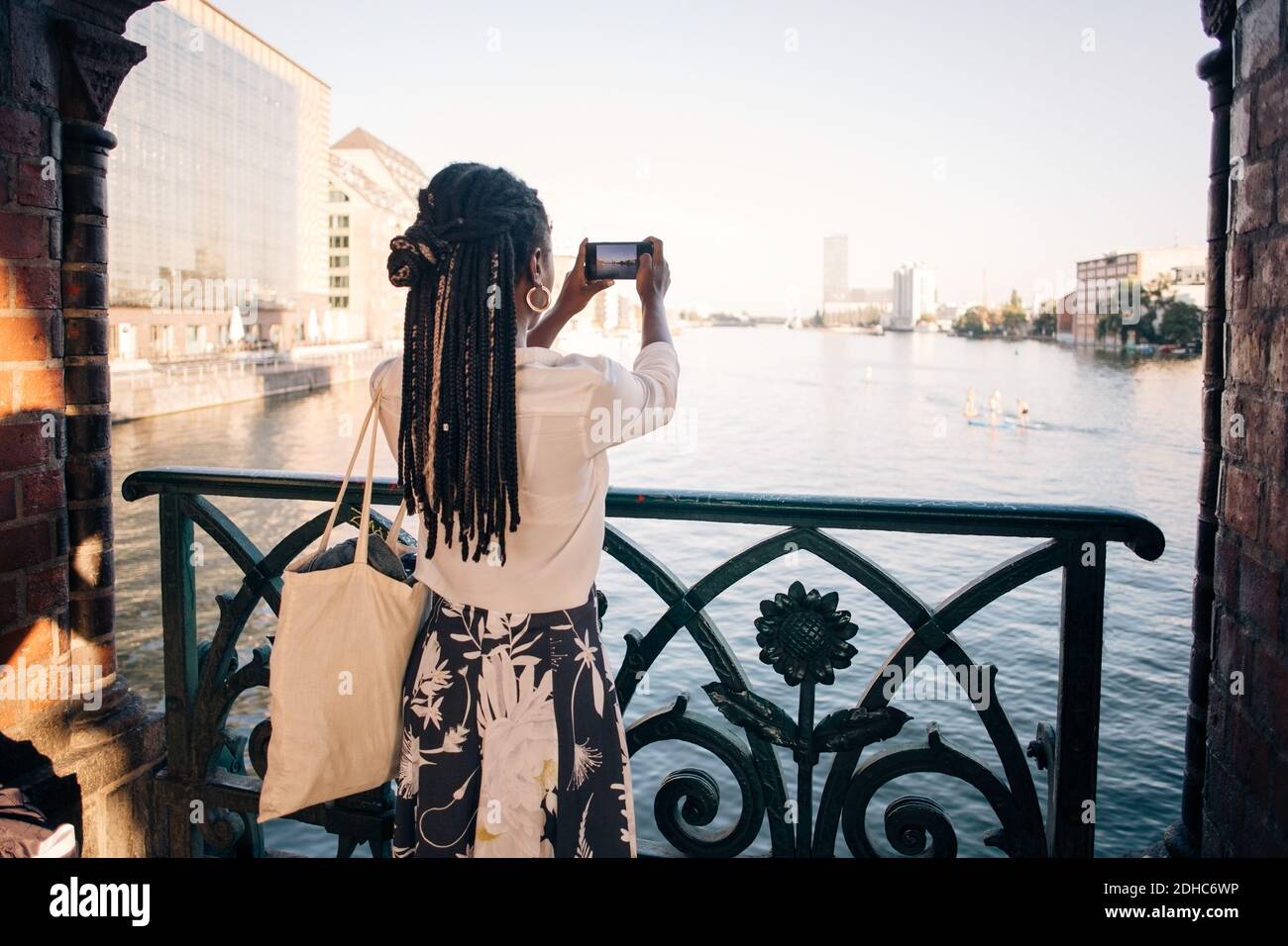 Rear view african woman using hi-res stock photography and images - Alamy