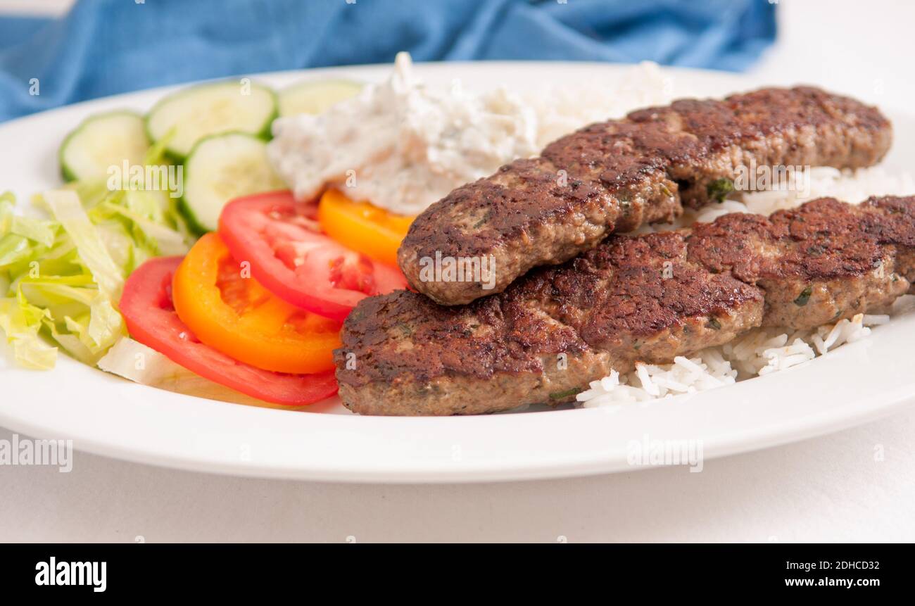 delicious flatbread wrap koobideh, iranian skewer with fresh vegetables