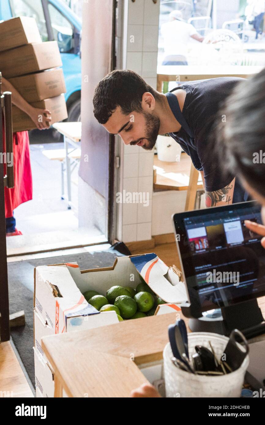 Multi-ethnic colleagues working at restaurant Stock Photo