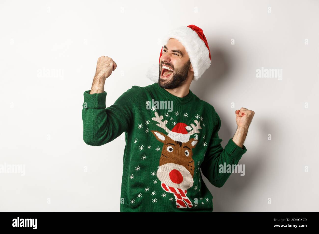 Christmas holidays, celebration and party concept. Happy guy in Santa