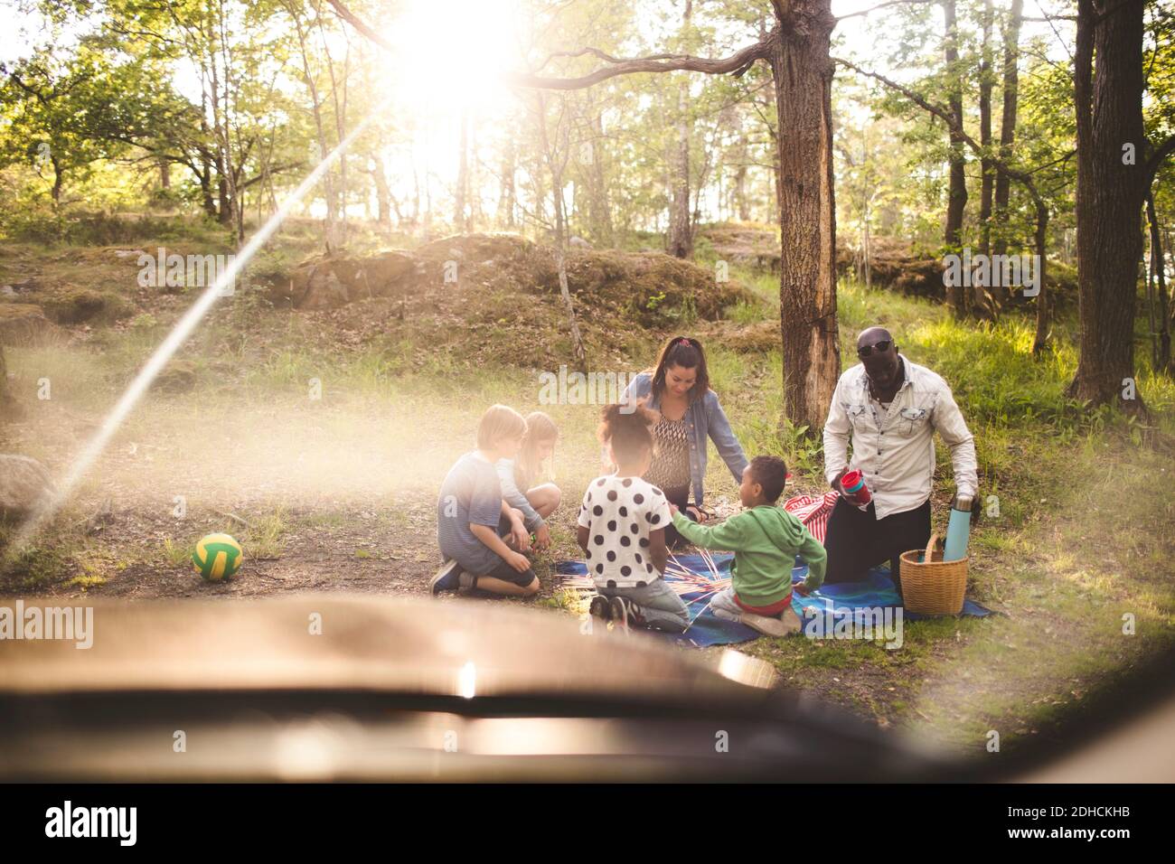 Multi-ethnic family enjoying picnic at park Stock Photo