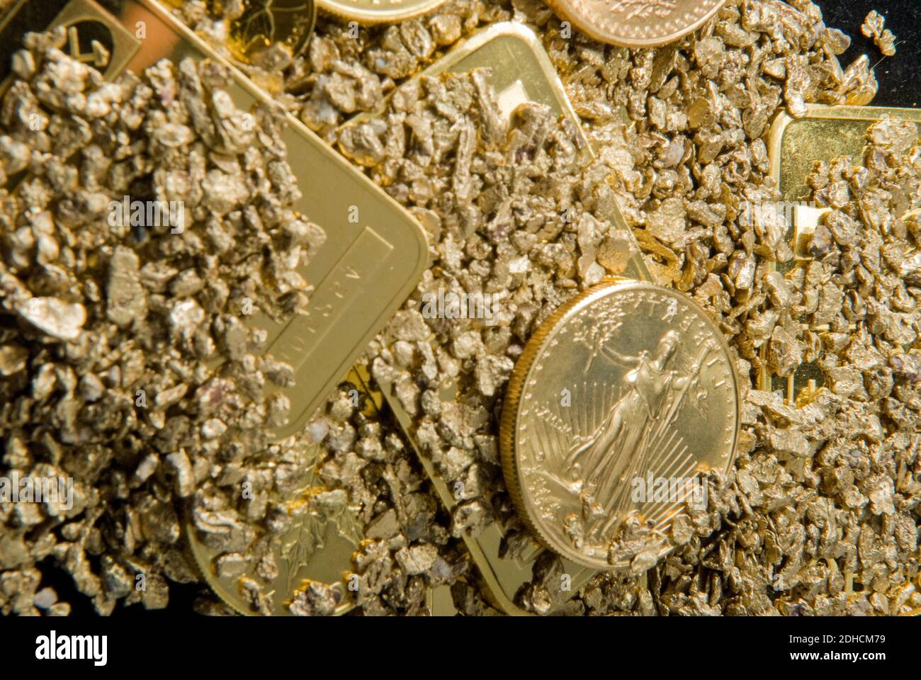 large samples of pure gold in various forms including coins, ingots