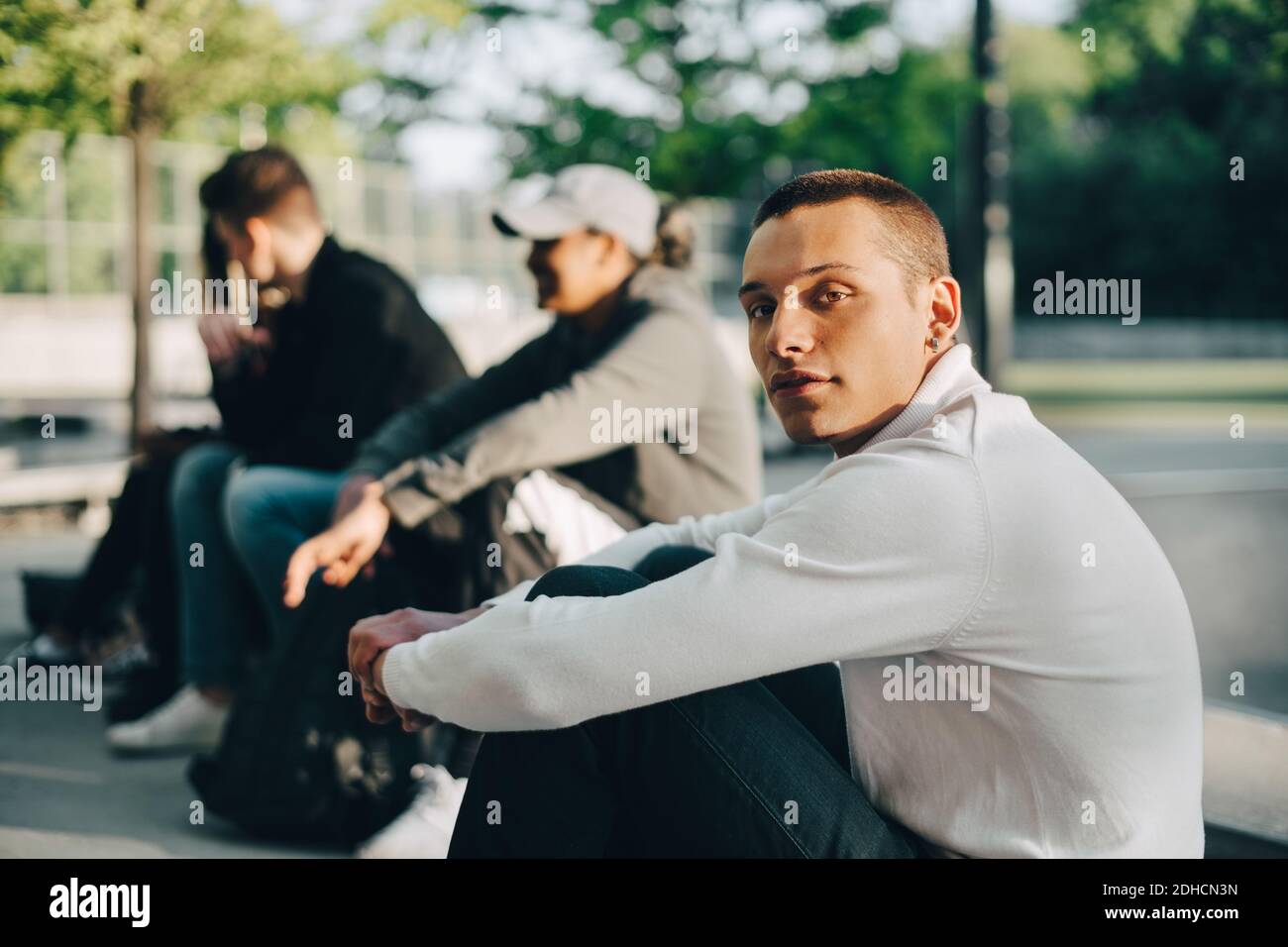 Young afro american man sitting hi-res stock photography and images - Alamy