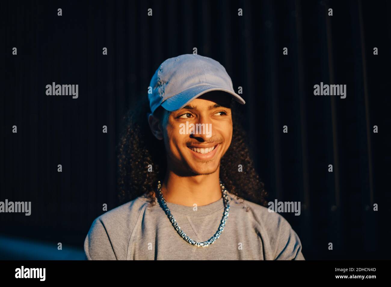 Man in the dark smiling hi-res stock photography and images - Alamy