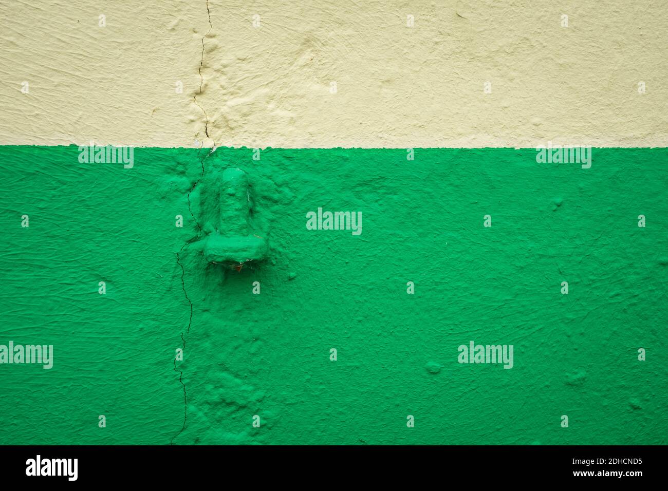 green and yellow paint on a wall Stock Photo - Alamy
