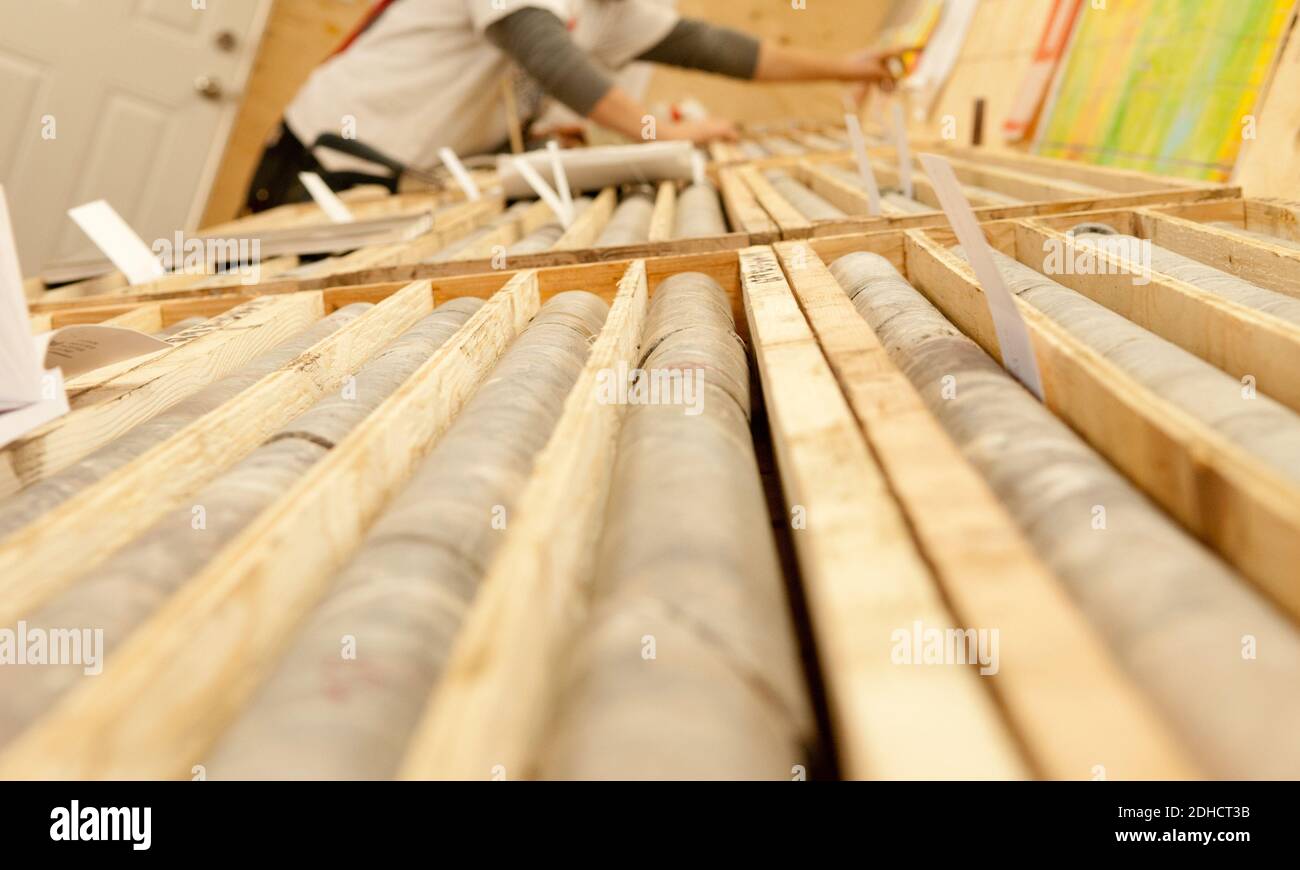 A closeup of stacked drilled core samples from the minesin wooden boxes Stock Photo