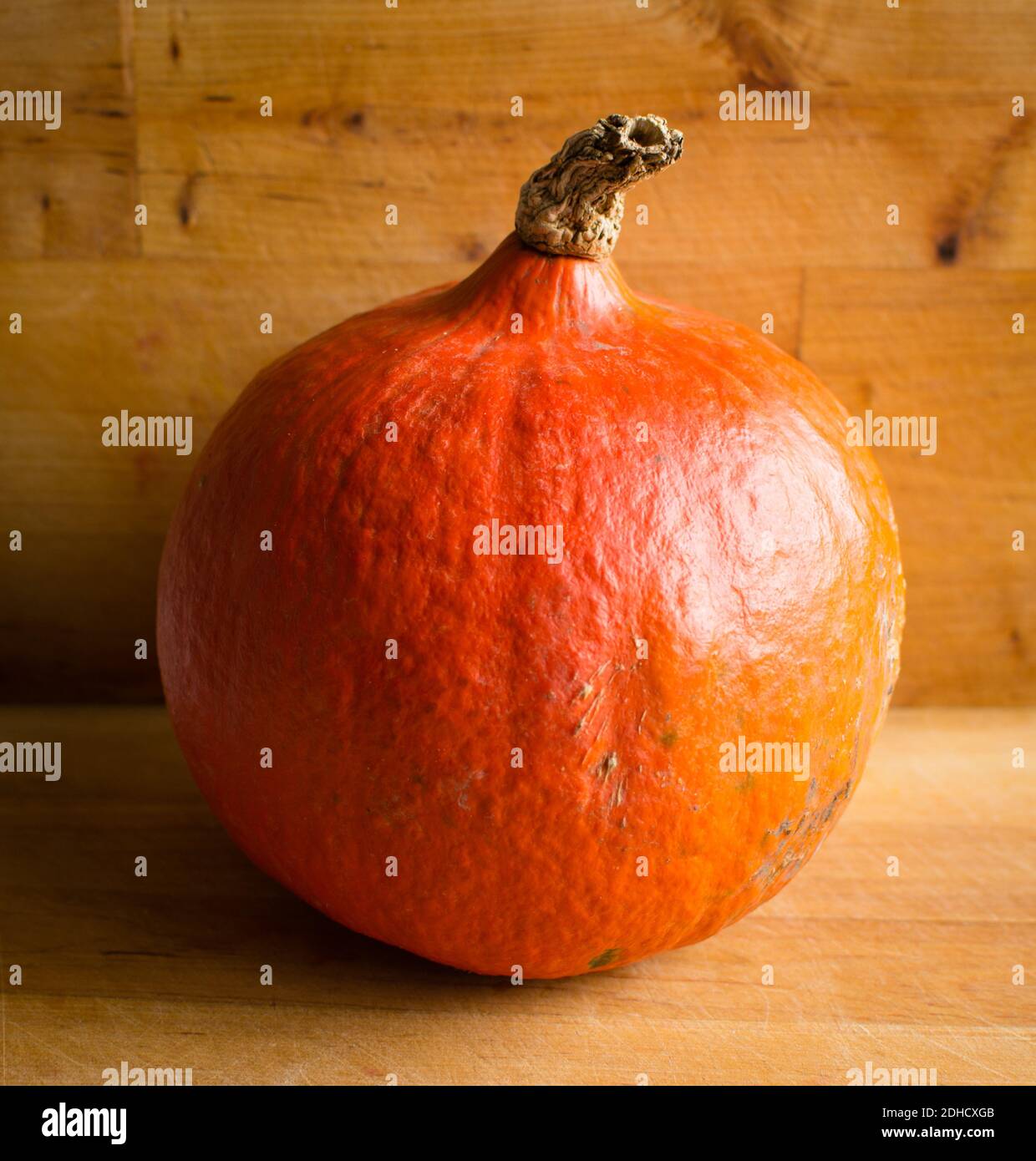 Fresh orange Hokkaido pumpkin on wooden background Stock Photo - Alamy