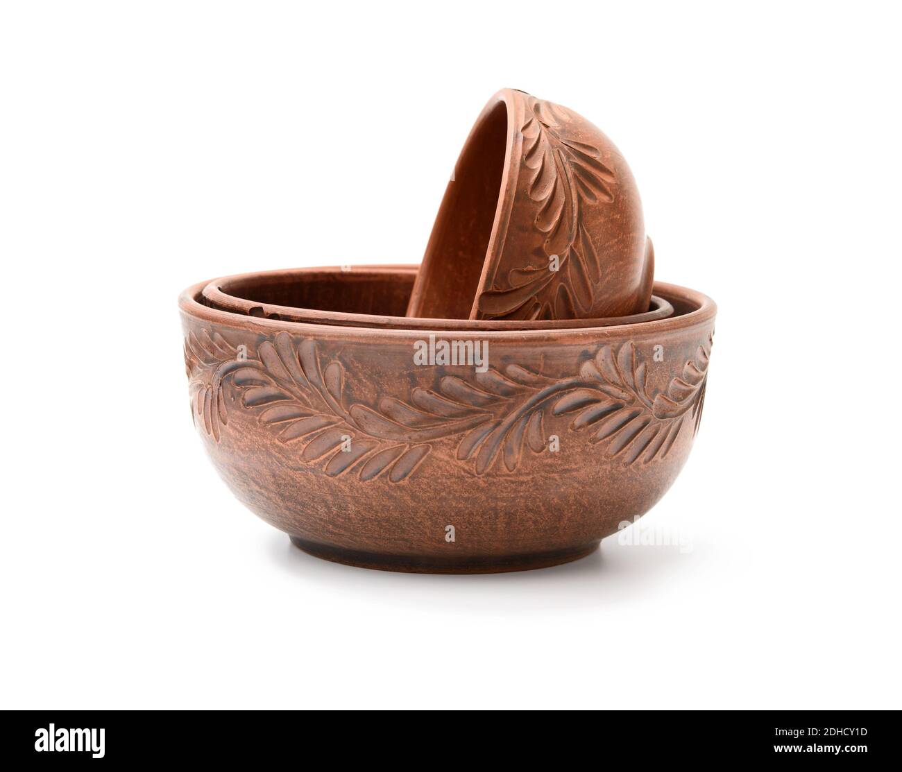 Brown clay plate isolated on white background Stock Photo