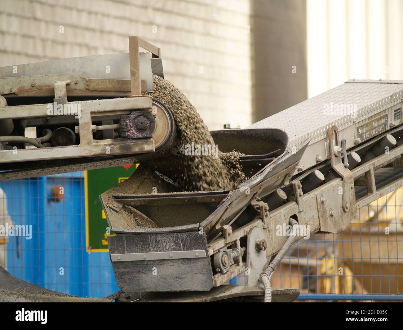 a conveyor belt throwing cement gravel off the truck Stock Photo Alamy