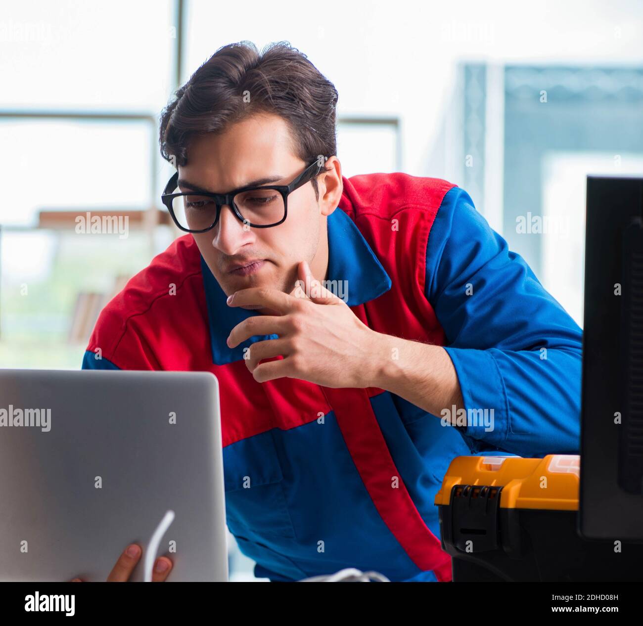 Computer Rebort Man Computer repairman working on repairing computer in IT workshop Stock ...