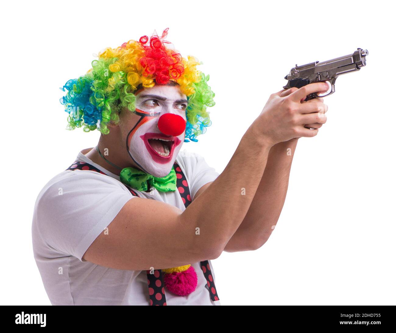 Funny clown with a gun pistol isolated on white background Stock Photo
