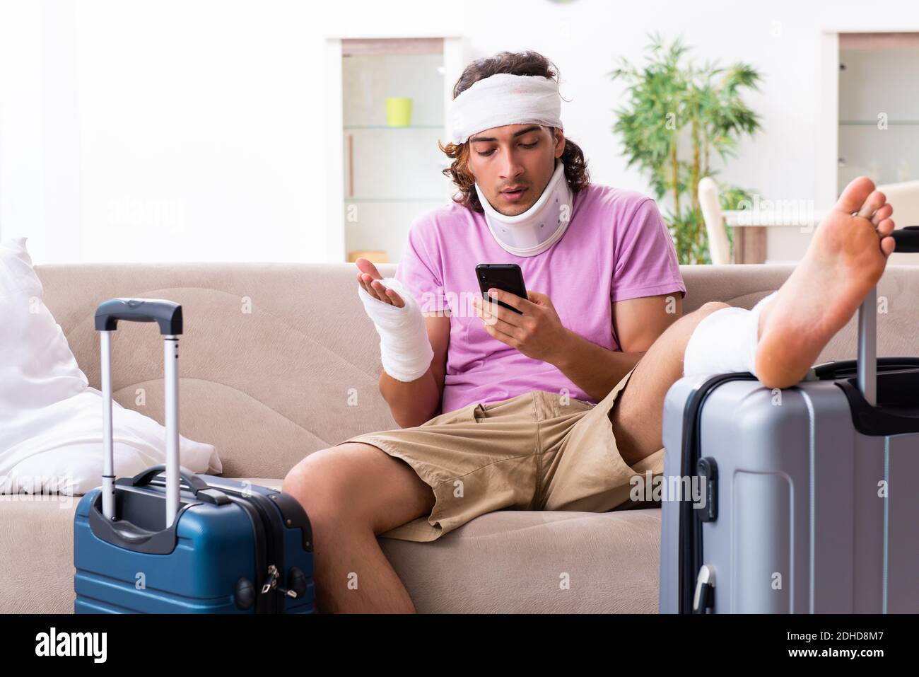 Young injured man preparing for the trip Stock Photo