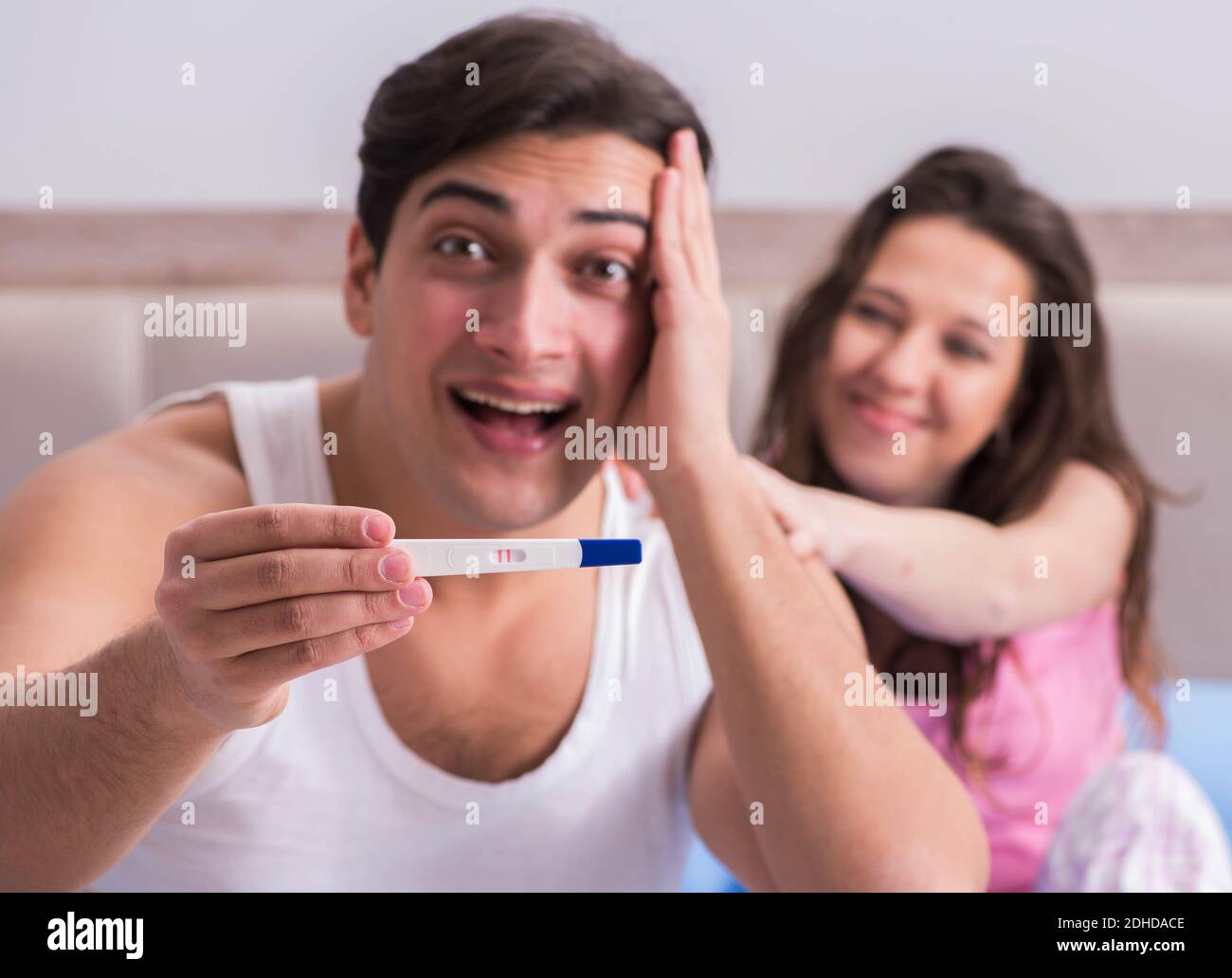 Young Family With Pregnancy Test Results Stock Photo Alamy