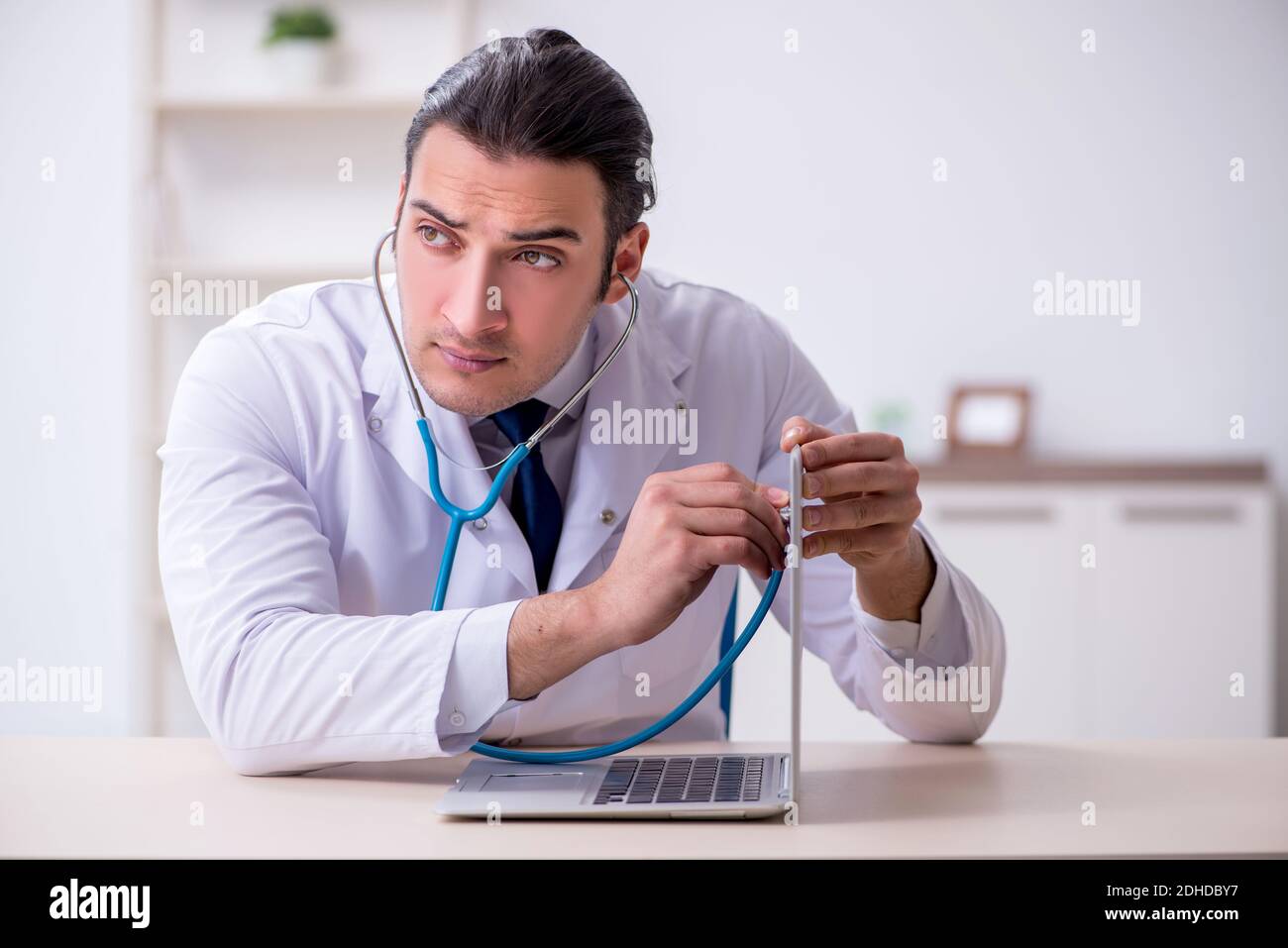Young doctor stethoscope repairing hi-res stock photography and images ...