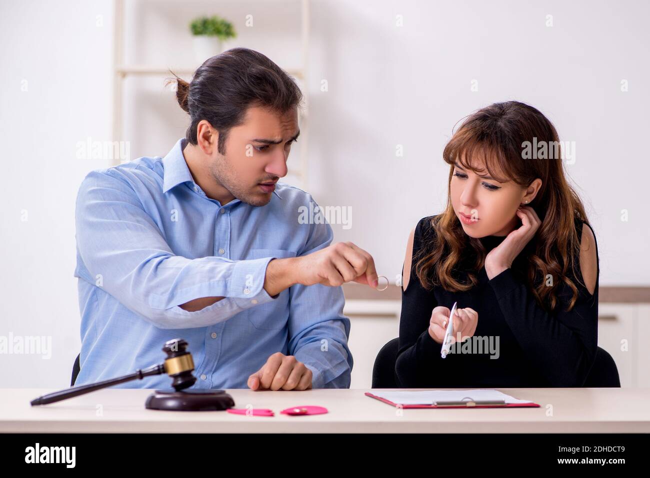 Young pair in courthouse in divorcing concept Stock Photo
