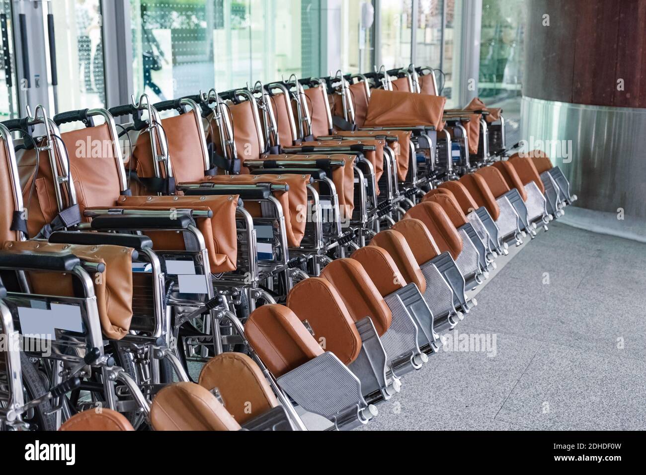 Row of Wheelchairs parked for patient service at the hospital Stock
