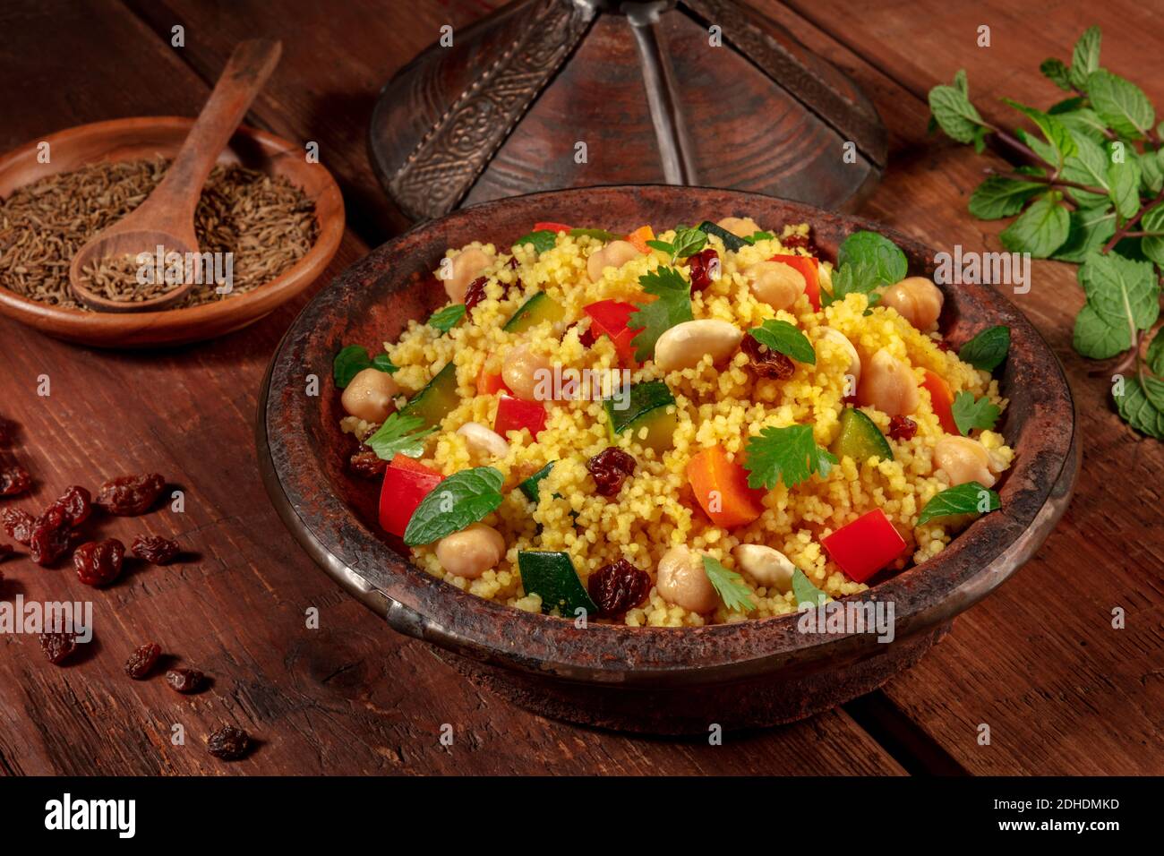 Moroccan couscous in a tagine with ingredients Stock Photo Alamy