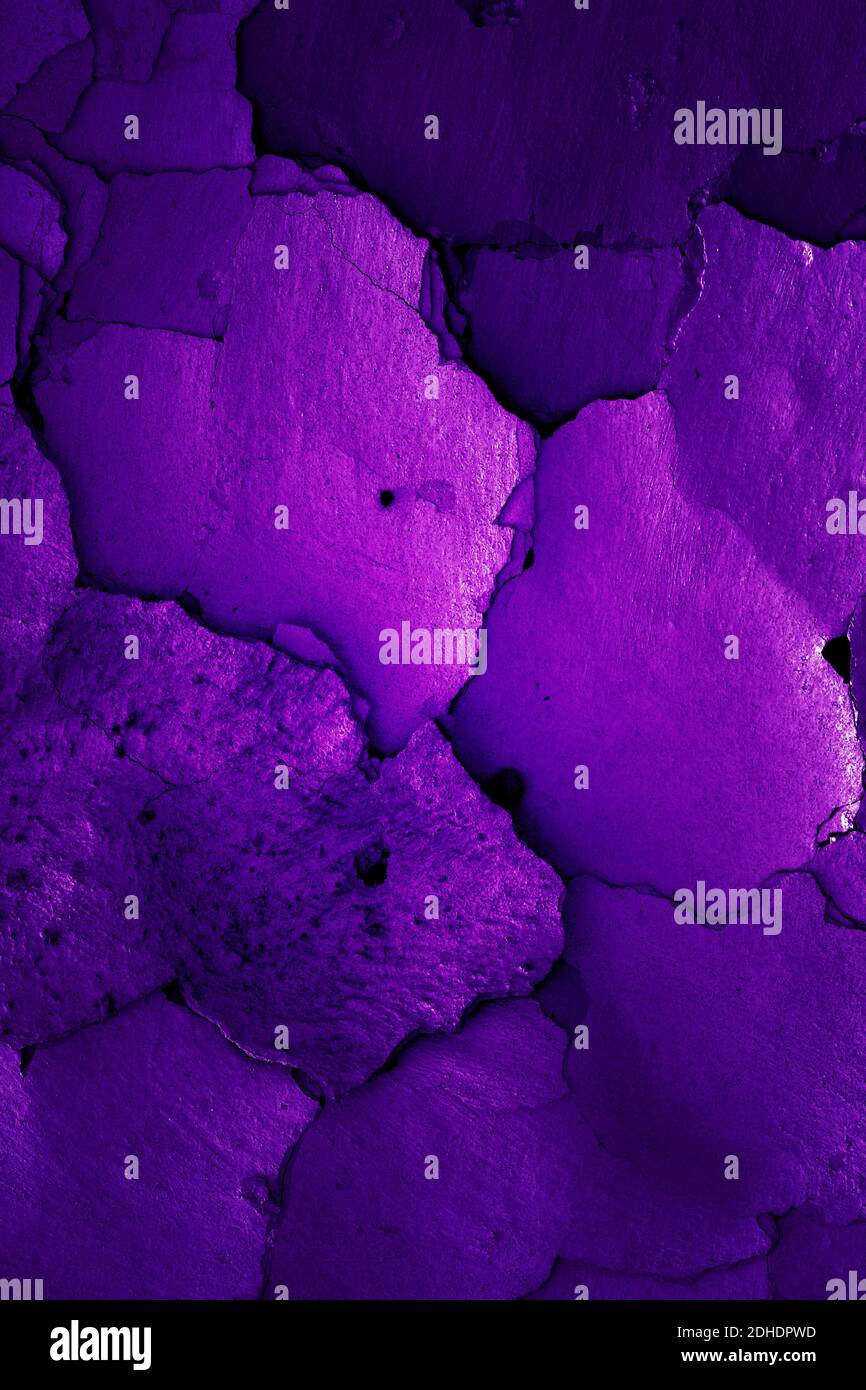 Old cracked wall in grape color Stock Photo