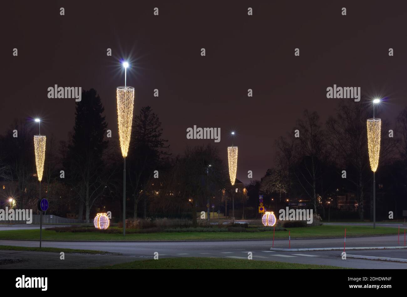 Christmas decorated lighting at Djursholms Ösby traffic circle, in Stockholm, Sweden, at night Stock Photo