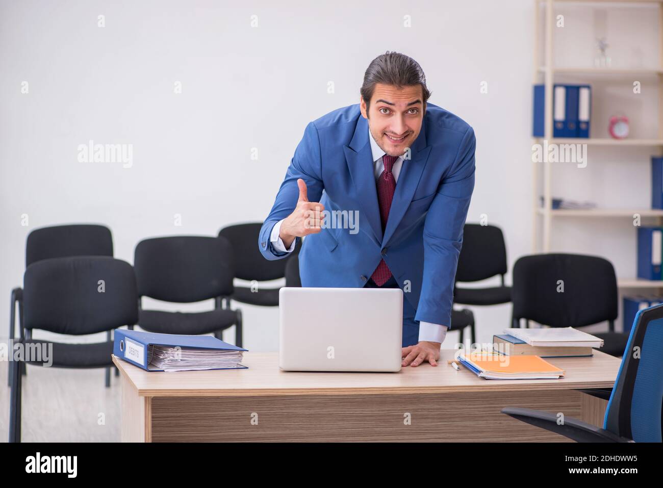 Young businessman making presentation during pandemic Stock Photo
