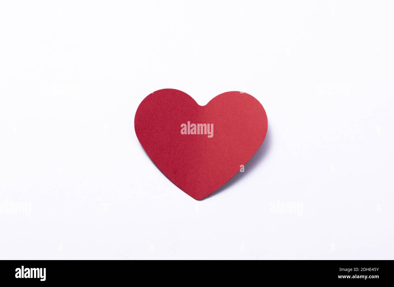 A red heart on white background Stock Photo - Alamy