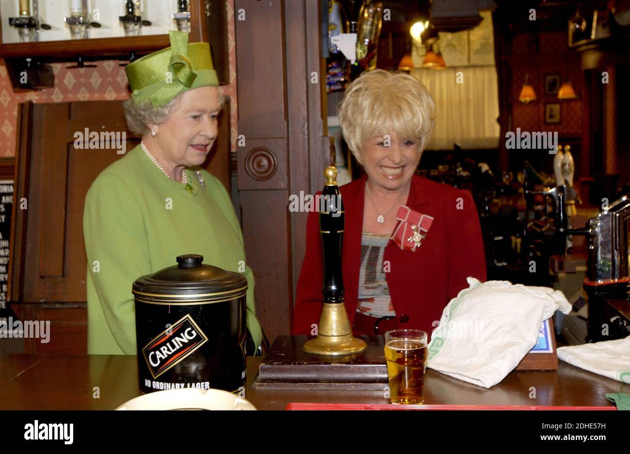 File photo dated 28/11/01 of Queen Elizabeth II with Barbara Windsor during her visit to Elstree Studios where the famous British soap opera Eastenders is filmed. The much-loved entertainer, best known for her roles in EastEnders and the Carry On films, has died aged 83. Stock Photo