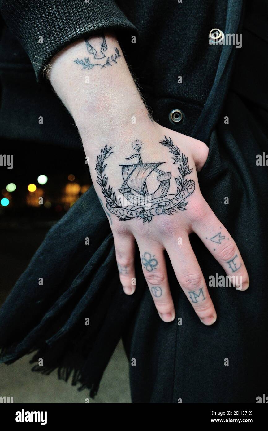 Cedric, 22 year old vendor, got tattooed with the Paris city motto 'Fluctuat Nec Mergitur', which means 'Tossed but not sunk'. He got his tattoo by Vonette a la Buche tattoo artist