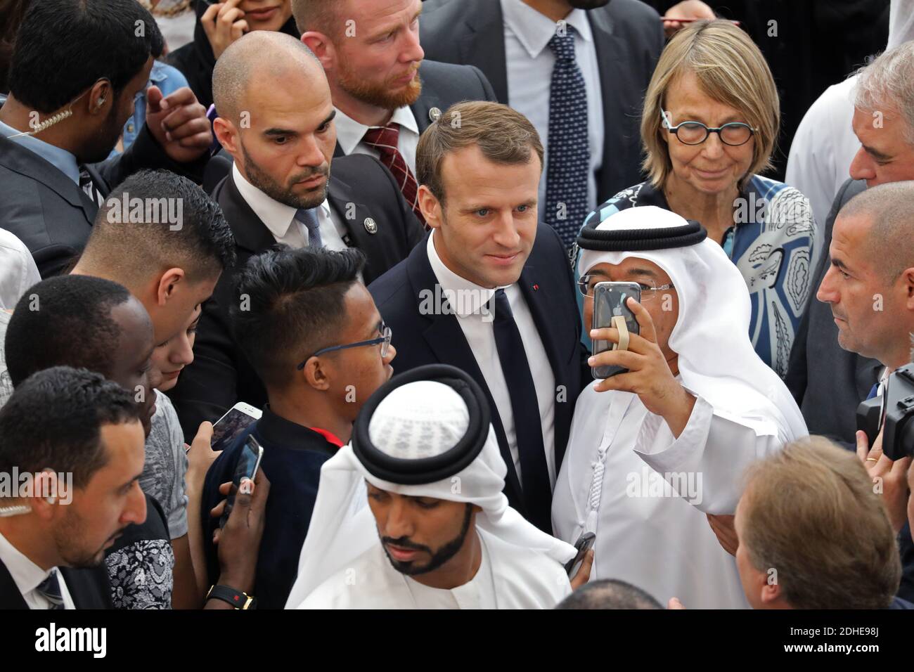 French President Emmanuel Macron poses for selfies with students during a  visit at Paris-Sorbonne University Abu Dhabi, United Arab Emirates on  November 9, 2017. Photo by Ludovic Marin/ Pool/ABACAPRESS.COM Stock Photo -