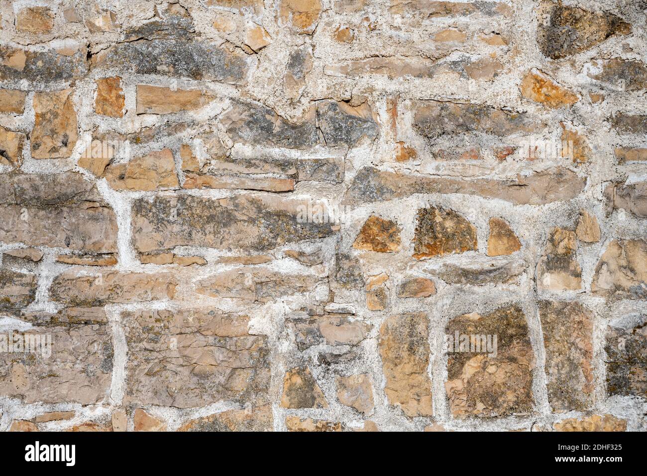 Background from an irregular natural stone wall Stock Photo
