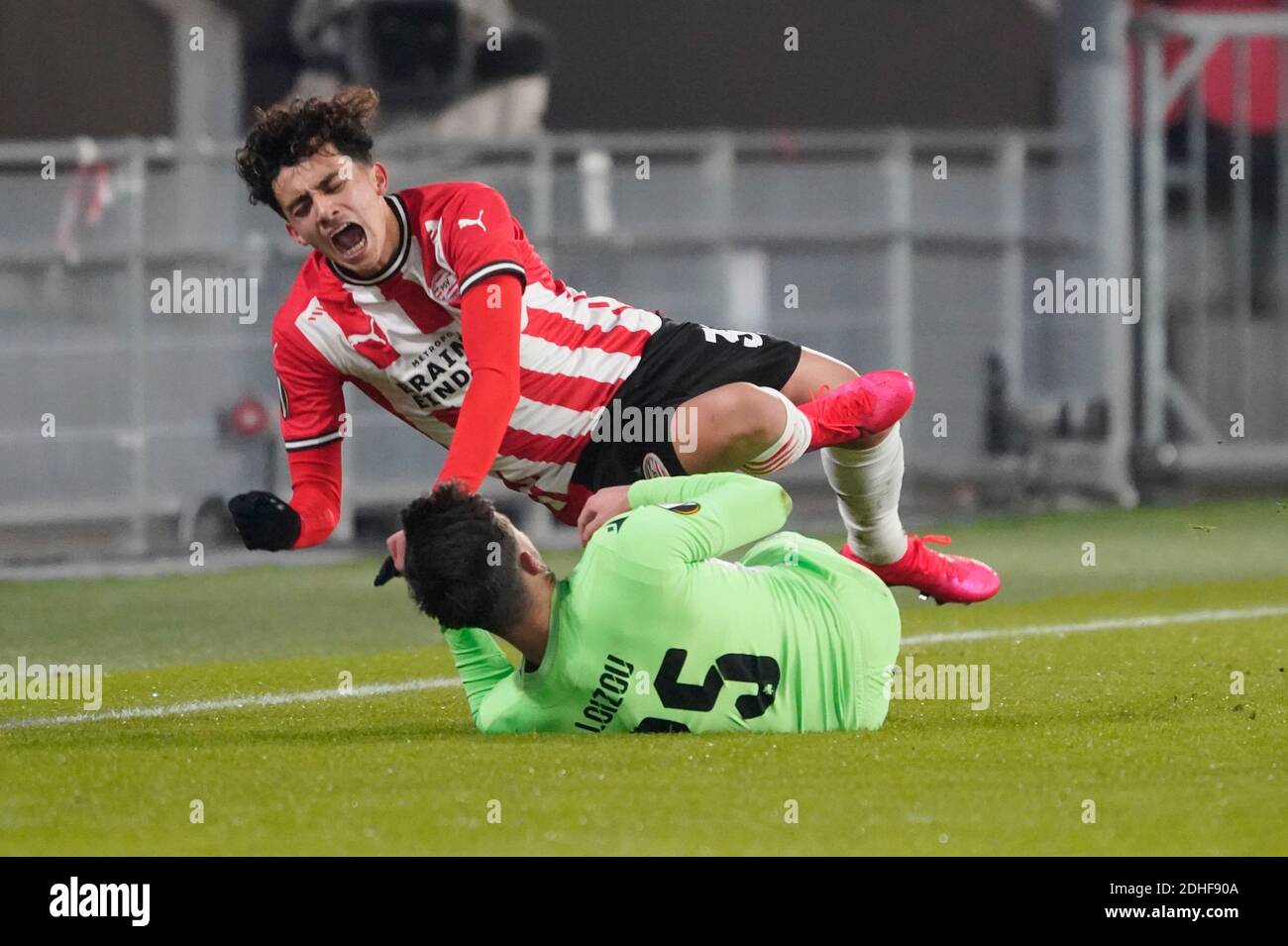 Eindhoven, Netherlands. 10th Dec, 2020. Richard Ledezma (PSV) is injured against Loizos Loizou of Omonoia FC during Uefa Europa League PSV Eindhoven vs Omonoia FC on December 10, 2020 in Eindhoven, Netherlands Photo by SCS/Soenar Chamid/AFLO (HOLLAND OUT) Credit: Aflo Co. Ltd./Alamy Live News Stock Photo