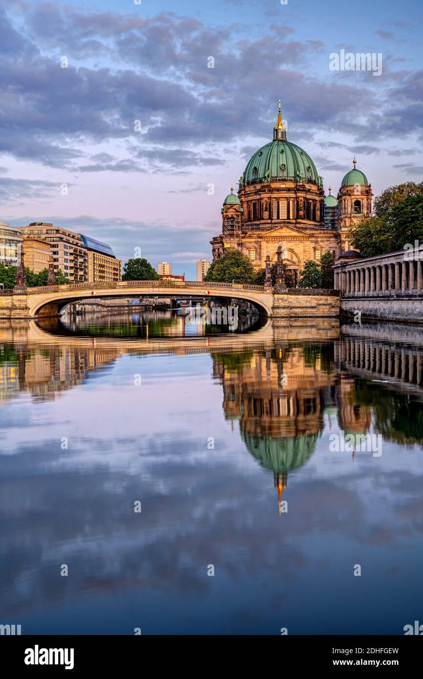 The Berlin Cathedral after sunset with a reflection in the river Spree Stock Photo