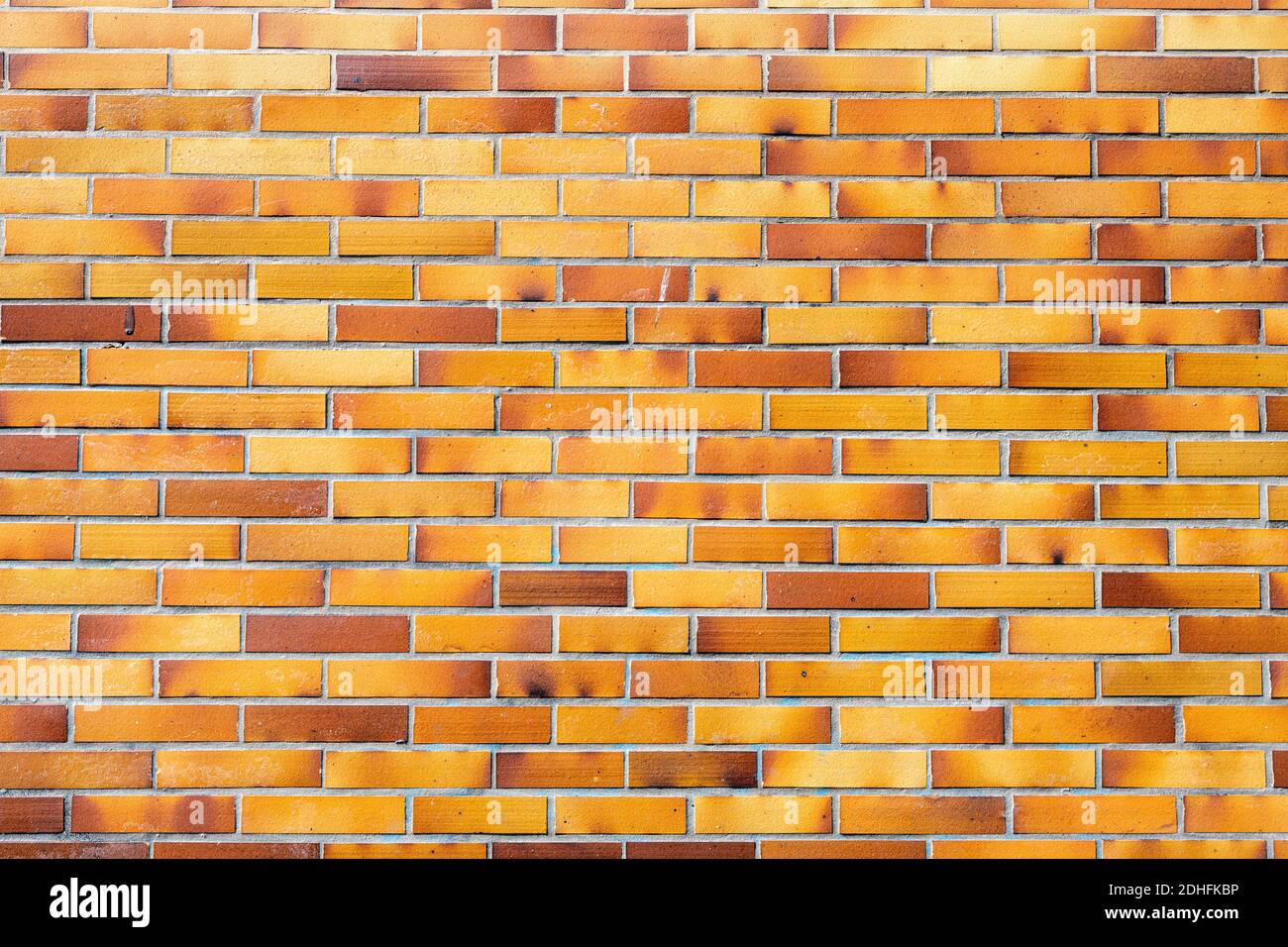 Background from a brownish wall of clinker bricks Stock Photo