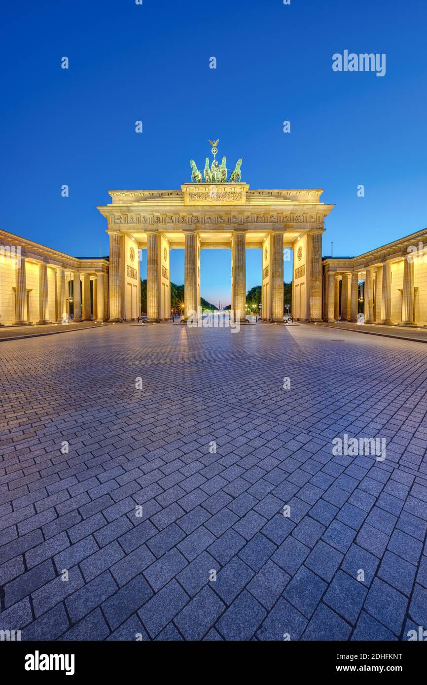 The illuminated Brandenburg Gate in Berlin at dusk with no people Stock Photo