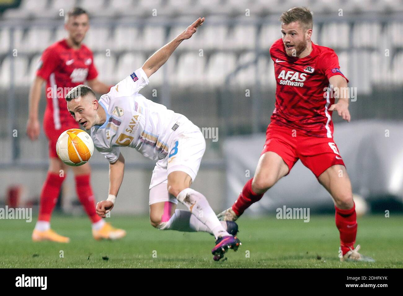 (201211) -- RIJEKA, Dec. 11, 2020 (Xinhua) -- Tibor Halilovic (L) of Rijeka vies with Fredrik Midtsjo of AZ Alkmaar during the UEFA Europa League group F football match between Rijeka of Croatia and AZ Alkmaar of the Netherlands at HNK Rijeka Stadium in Rijeka, Croatia, Dec. 10, 2020. (Luka Stanzl/Pixsell via Xinhua) Stock Photo