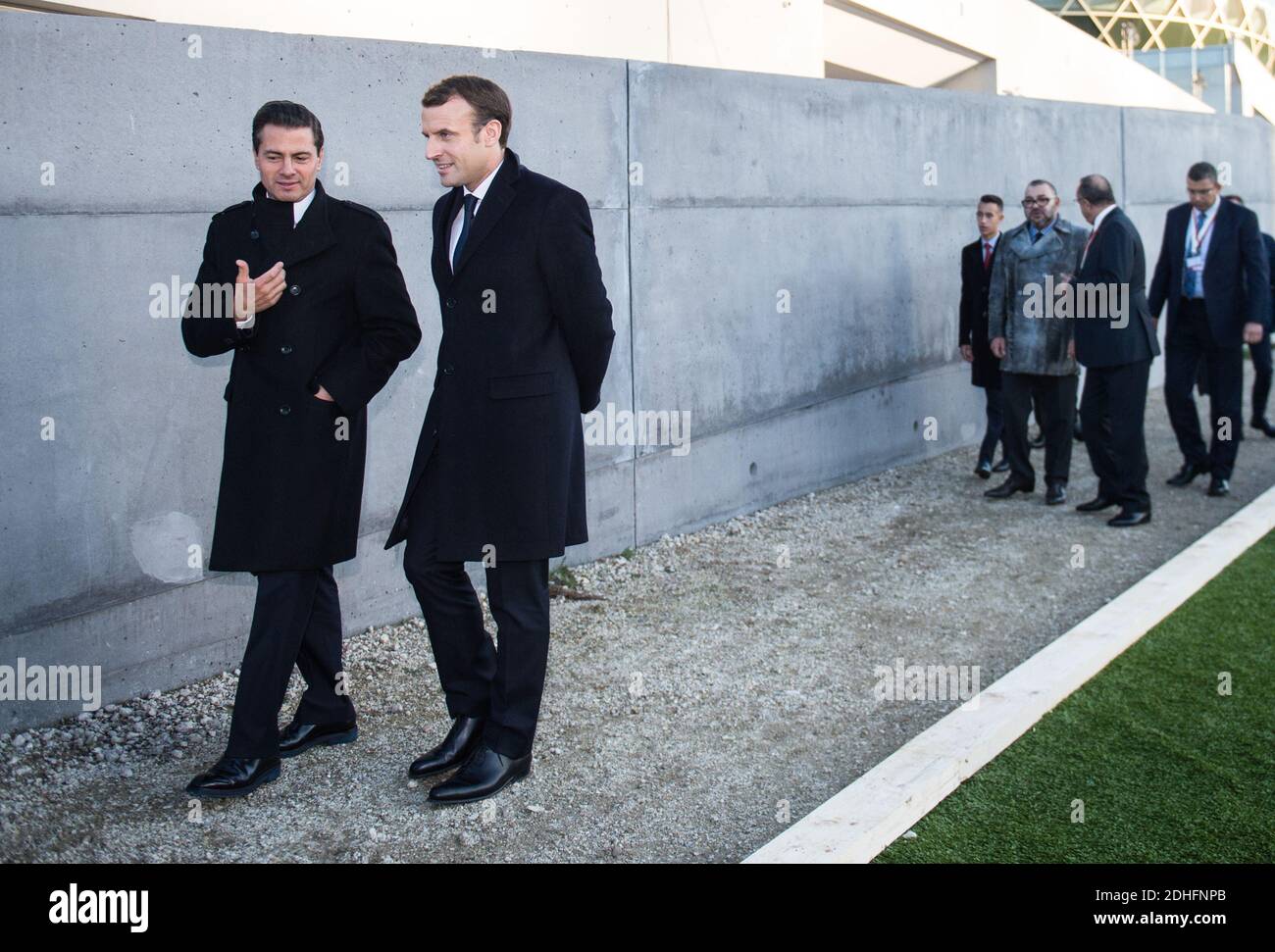 French President Emmanuel Macron (R) and Mexican President Enrique Pena Nieto talk upon their arrival to the One Planet Summit on December 12, 2017, at La Seine Musicale venue on the ile Seguin in Boulogne-Billancourt, southwest of Paris. Photo by Eliot Blondet/ABACAPRESS.COM Stock Photo