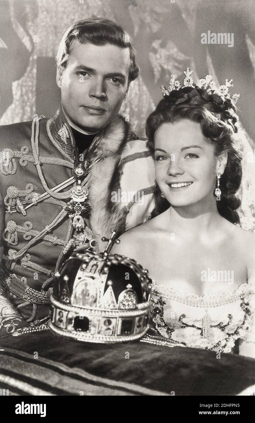 1955 , AUSTRIA  :  The movie actress   ROMY  SCHNEIDER ( 1938 - 1982 ) as the Queen of Hungry and  Empress SISSI  Elisabeth Absburg of Austria in   '  Sissi  '  by Ernst Marischka , KARL HEINZ BOHM as the Kaiser Franz Josef  - ATTRICE - MOVIE - FILM - CINEMA - ASBURGO - ABSBURGO -  portrait - ritratto  - sorriso -  tiara - corona - crown - diamanti - diamonds - diamante - diamond - jewellery - jewel - jewels - gioiello - gioielli  - scollatura - neckline - neckopening  - military uniform uniforme militare - medals - decorations - Toson d' Oro - medaglia - medaglie - decorazioni - orecchino - o Stock Photo