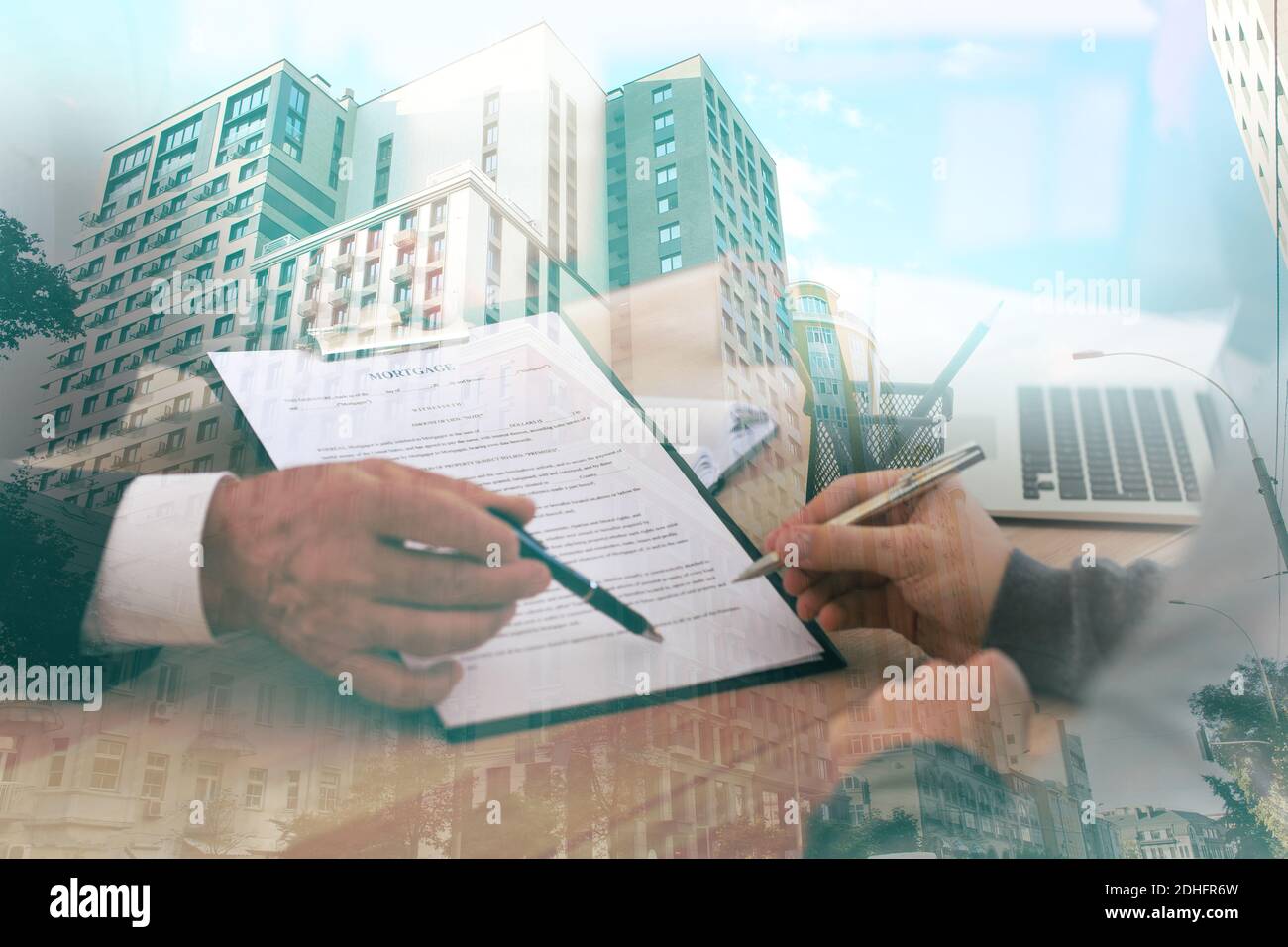 Double exposure of man signing documents and modern city. Concept of ...