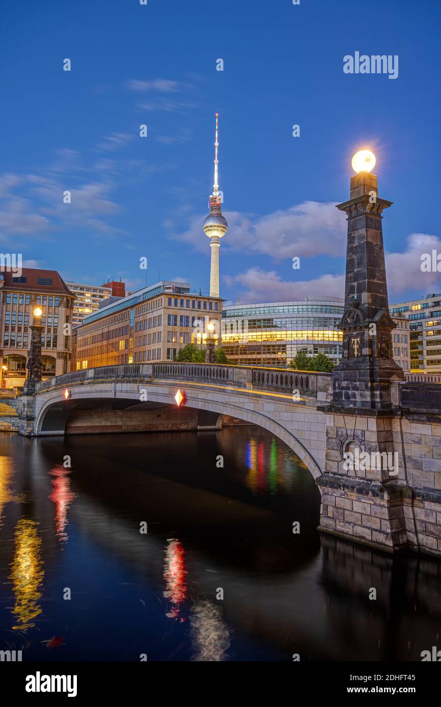 Historic bridge over the river Spree in Berlin at dawn with the Television Tower in the back Stock Photo